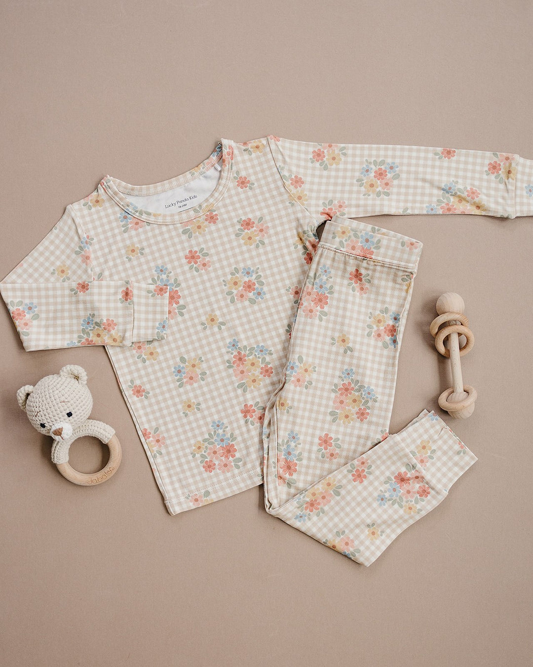 Lucky Panda Kids Wild Flower bamboo long-sleeve top and matching pajama pants displayed flat.