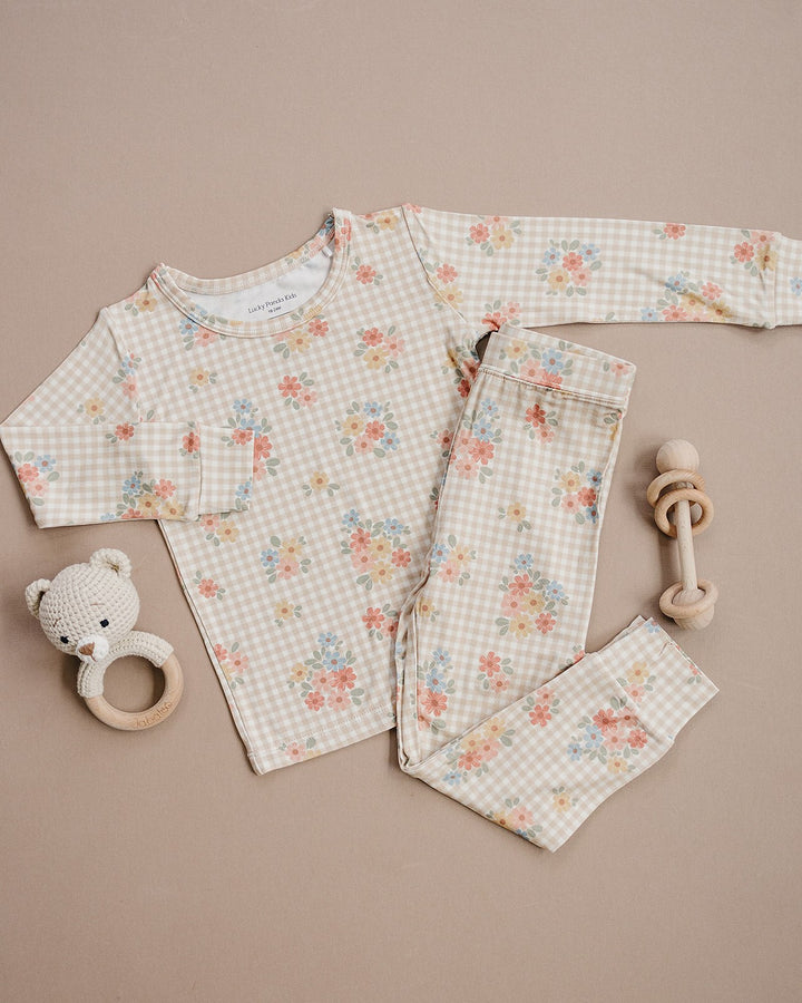 Lucky Panda Kids Wild Flower bamboo long-sleeve top and matching pajama pants displayed flat.