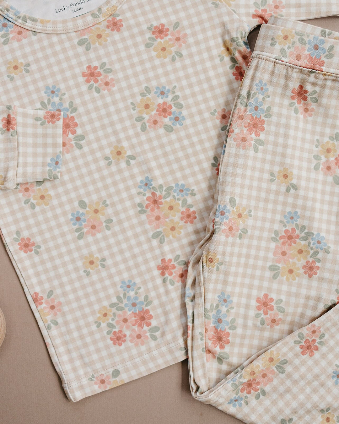 Close-up of the Wild Flower bamboo pajama pants, showing the pastel floral gingham print.