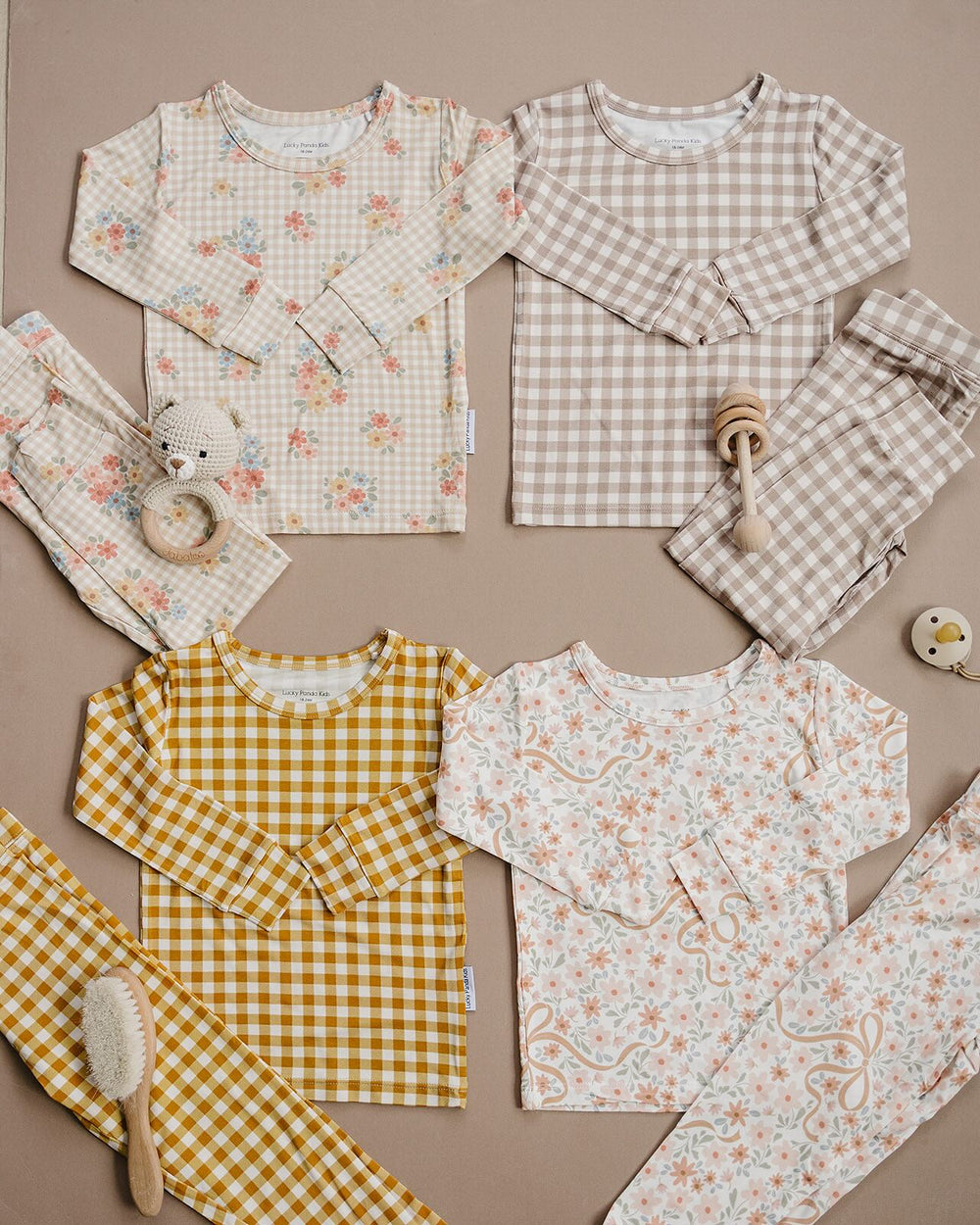 Bamboo two-piece set displayed with coordinating Lucky Panda Kids fall styles. Yellow Gingham, Beige Gingham, Wildflowers, Cozy Daisy