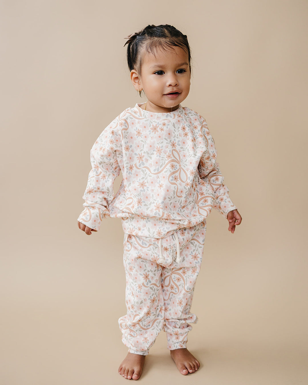 Cozy Daisy cotton jogger set displayed with coordinating Lucky Panda Kids gingham and floral styles.