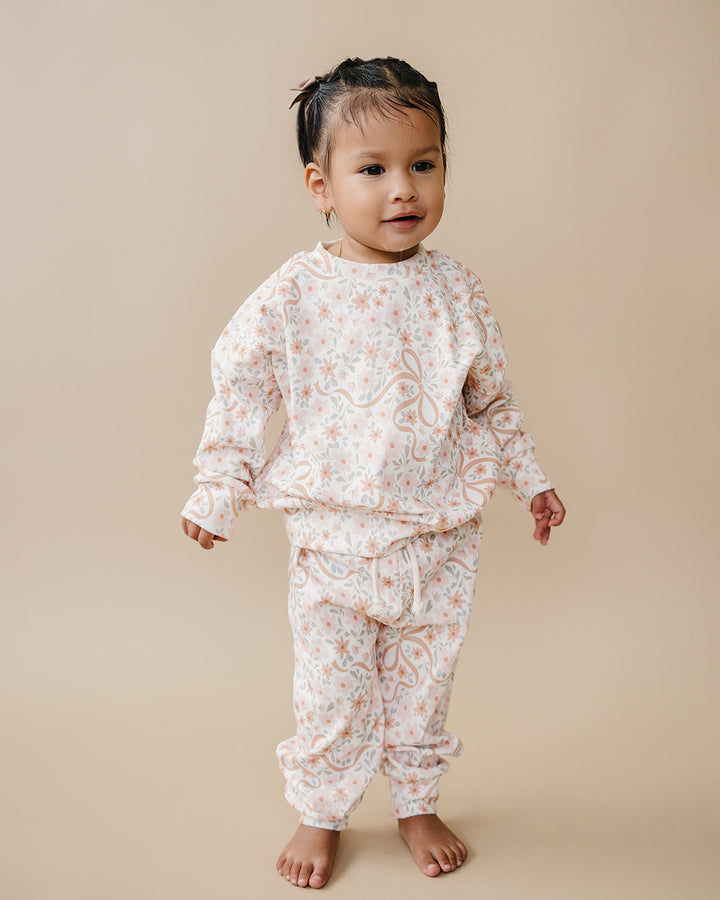 Cozy Daisy cotton jogger set displayed with coordinating Lucky Panda Kids gingham and floral styles.