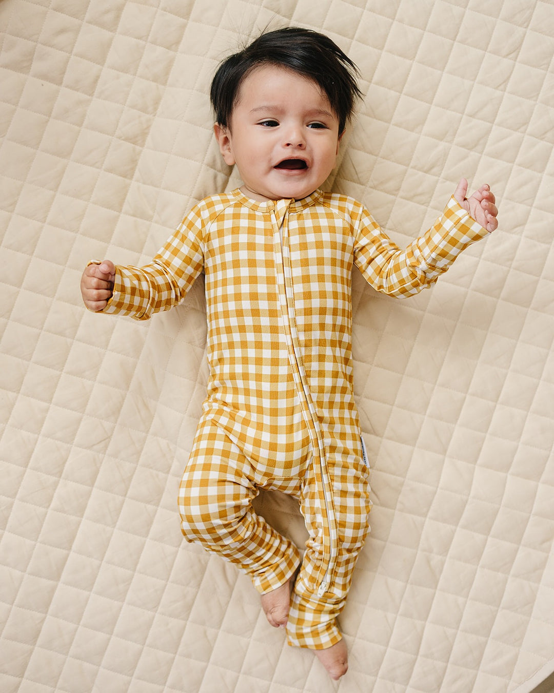 Lucky Panda Kids Yellow Gingham bamboo zip romper displayed flat with neutral baby accessories.