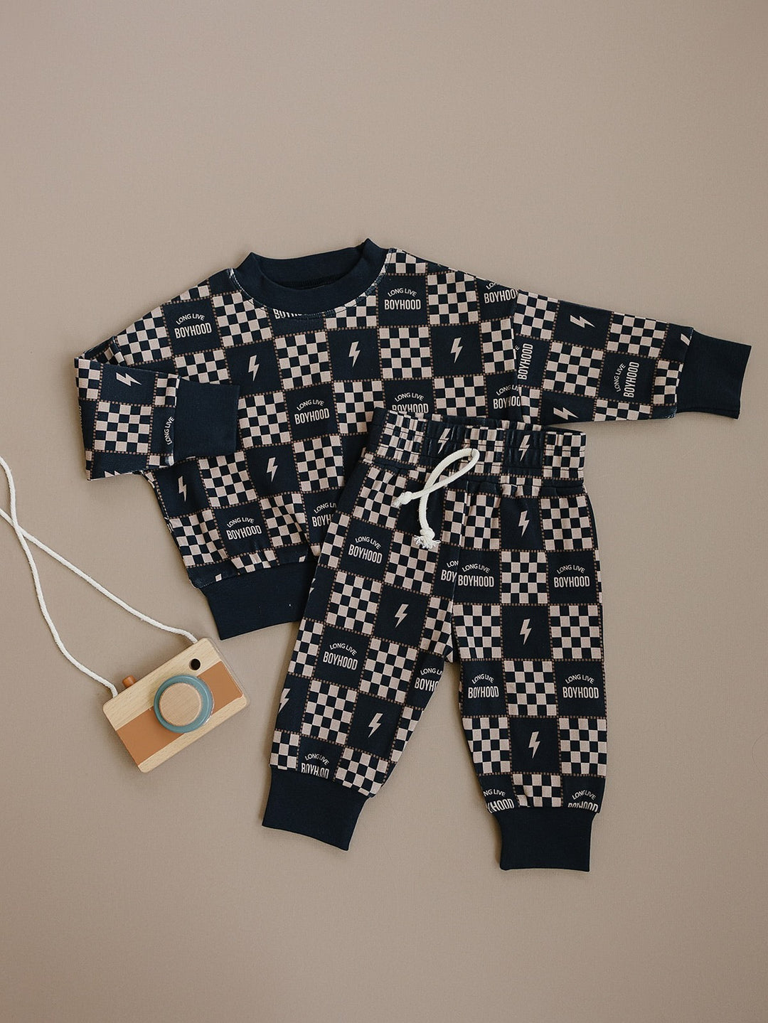 Long Live Boyhood cotton long-sleeve top and matching joggers with dark cuffs displayed flat.