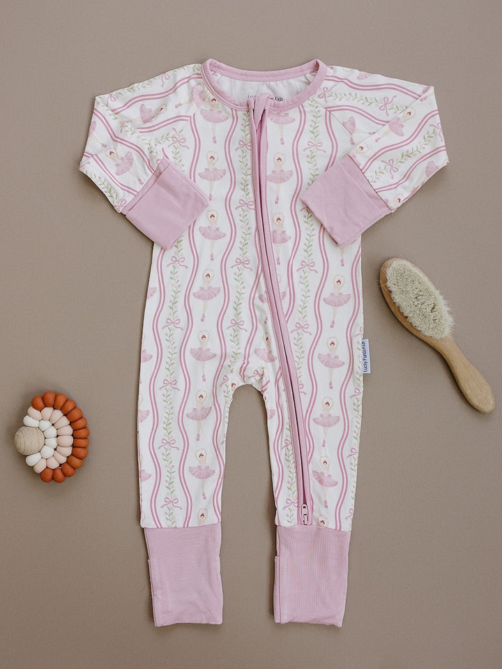 Little Ballerina bamboo zip romper with pink trim displayed as a flat lay.