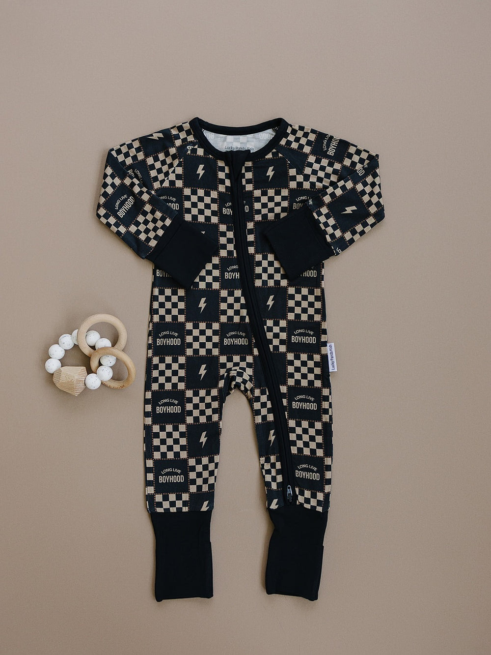 Long Live Boyhood bamboo zip romper with charcoal and beige checkered print and dark cuffs displayed flat.