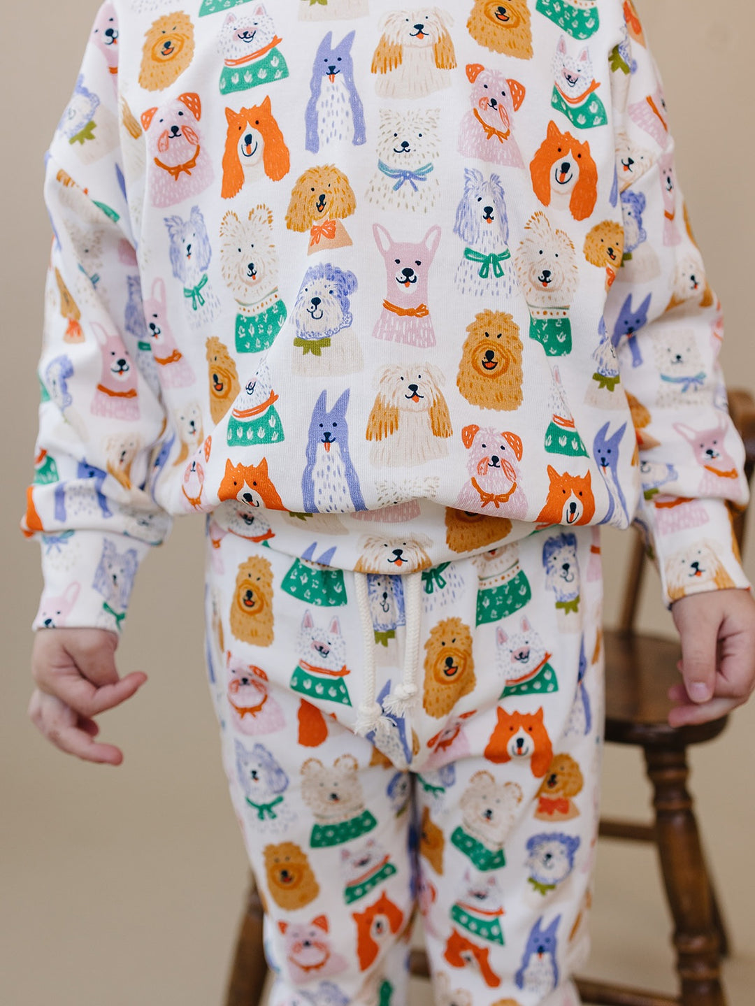 Close-up of the colorful puppy print on the Puppy Club cotton top and matching joggers.