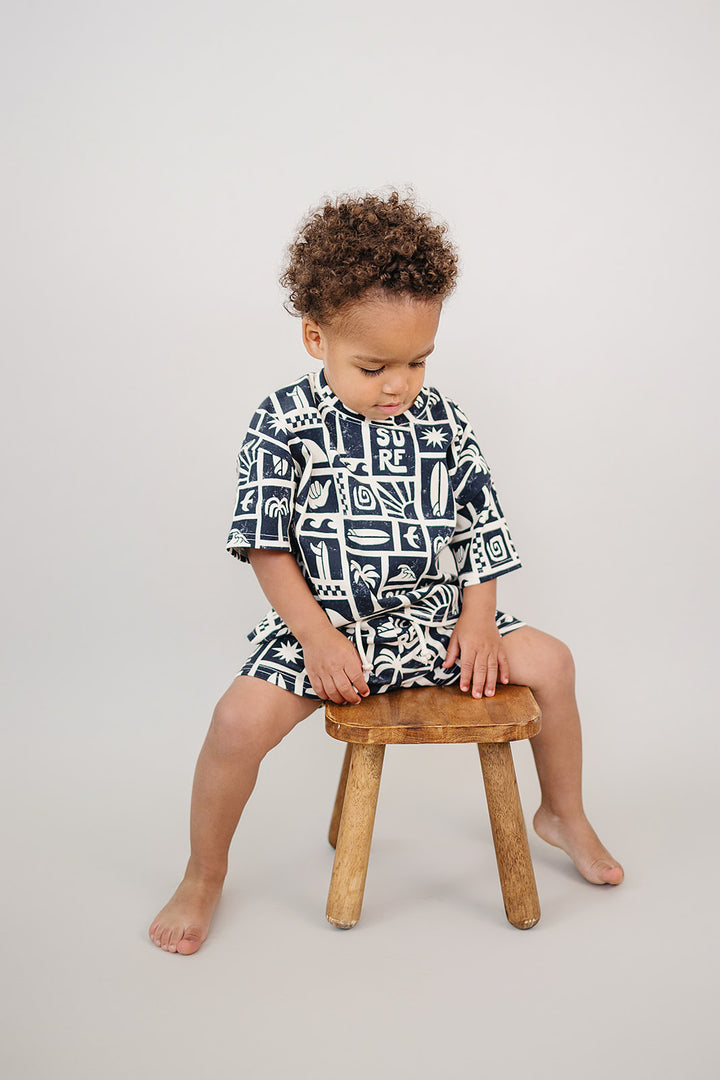 Coastal Club Cotton Shorts Set — toddler in coastal-print summer two-piece, Lucky Panda Kids
Lucky Panda Kids Coastal Club Cotton Shorts Set flat lay — Summer1 Collection
Close-up of Coastal Club Cotton Shorts Set showing coastal print and soft cotton weave
Child wearing Coastal Club Cotton Shorts Set at the beach — Lucky Panda Kids summer style
Coastal Club Cotton Shorts Set NB to 9Y — Lucky Panda Kids Summer1 Collection
