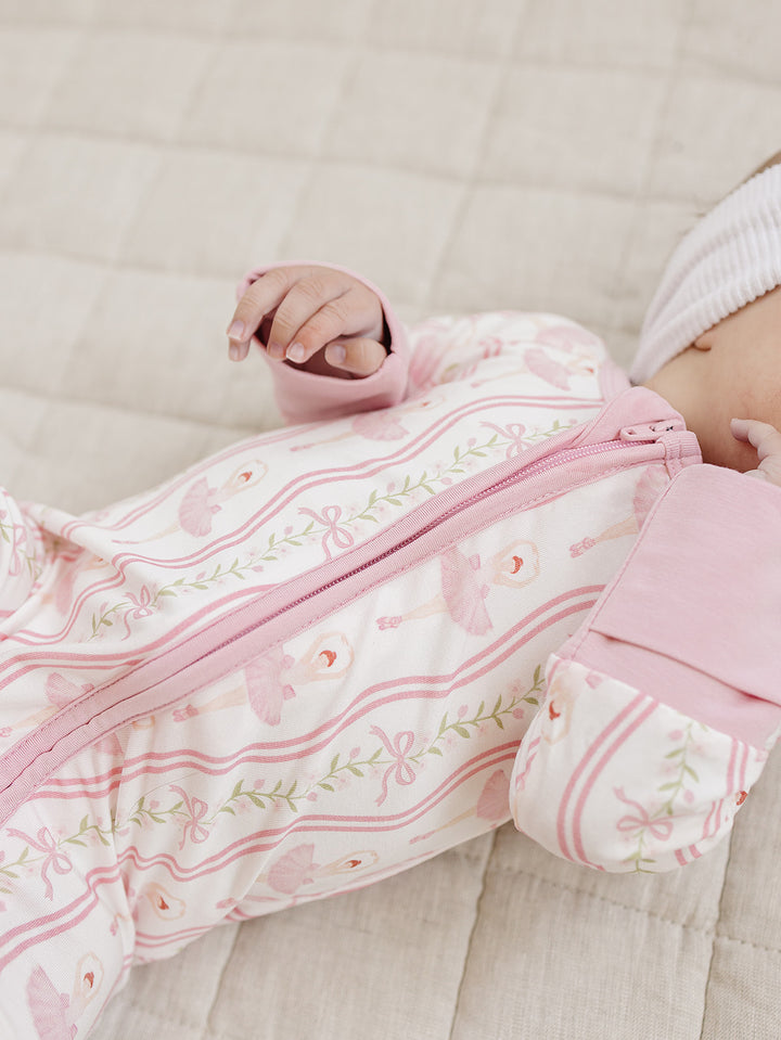 Close-up of the pink ballerina print and soft bamboo fabric on the Little Ballerina romper.
