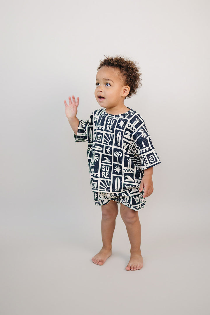 Coastal Club Cotton Shorts Set — toddler in coastal-print summer two-piece, Lucky Panda Kids
Lucky Panda Kids Coastal Club Cotton Shorts Set flat lay — Summer1 Collection
Close-up of Coastal Club Cotton Shorts Set showing coastal print and soft cotton weave
Child wearing Coastal Club Cotton Shorts Set at the beach — Lucky Panda Kids summer style
Coastal Club Cotton Shorts Set NB to 9Y — Lucky Panda Kids Summer1 Collection
