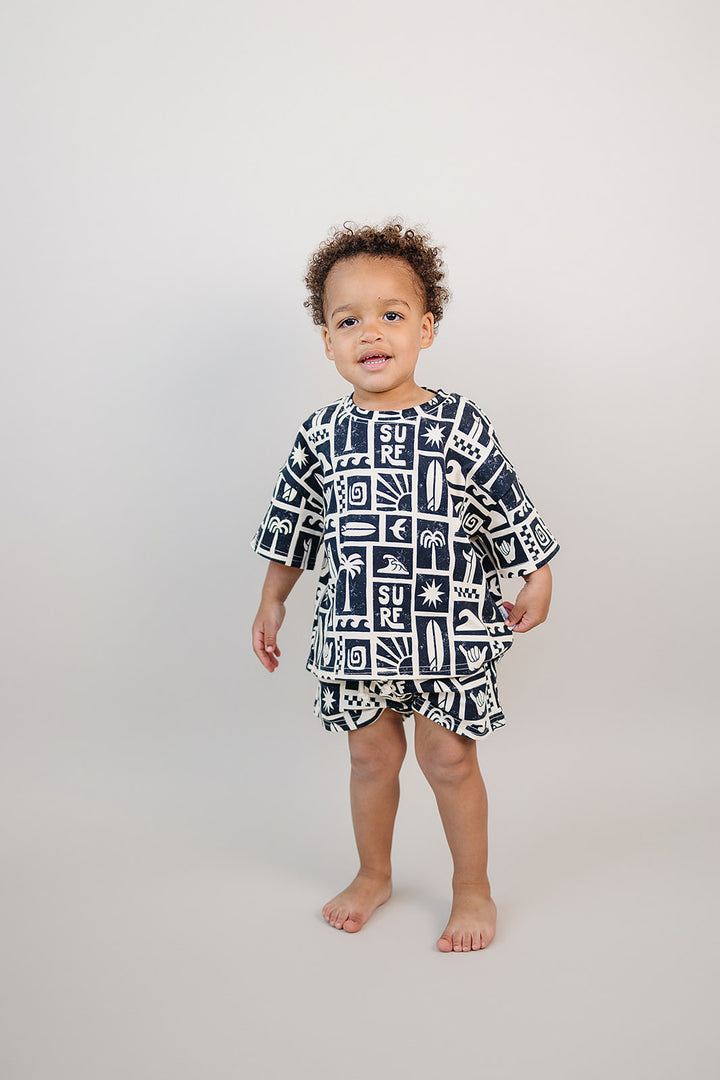Coastal Club Cotton Shorts Set — toddler in coastal-print summer two-piece, Lucky Panda Kids
Lucky Panda Kids Coastal Club Cotton Shorts Set flat lay — Summer1 Collection
Close-up of Coastal Club Cotton Shorts Set showing coastal print and soft cotton weave
Child wearing Coastal Club Cotton Shorts Set at the beach — Lucky Panda Kids summer style
Coastal Club Cotton Shorts Set NB to 9Y — Lucky Panda Kids Summer1 Collection
