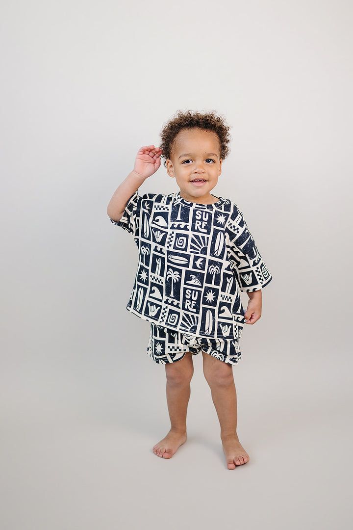 Coastal Club Cotton Shorts Set — toddler in coastal-print summer two-piece, Lucky Panda Kids
Lucky Panda Kids Coastal Club Cotton Shorts Set flat lay — Summer1 Collection
Close-up of Coastal Club Cotton Shorts Set showing coastal print and soft cotton weave
Child wearing Coastal Club Cotton Shorts Set at the beach — Lucky Panda Kids summer style
Coastal Club Cotton Shorts Set NB to 9Y — Lucky Panda Kids Summer1 Collection
