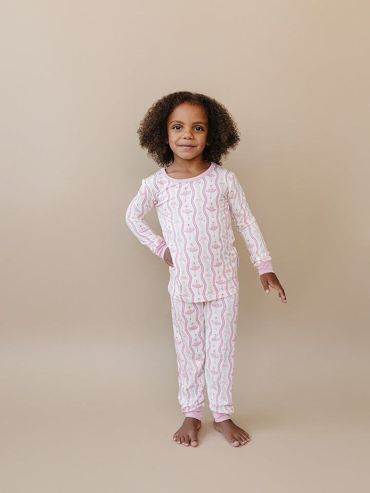 Full-length view of a child modeling the Little Ballerina bamboo pajama set.