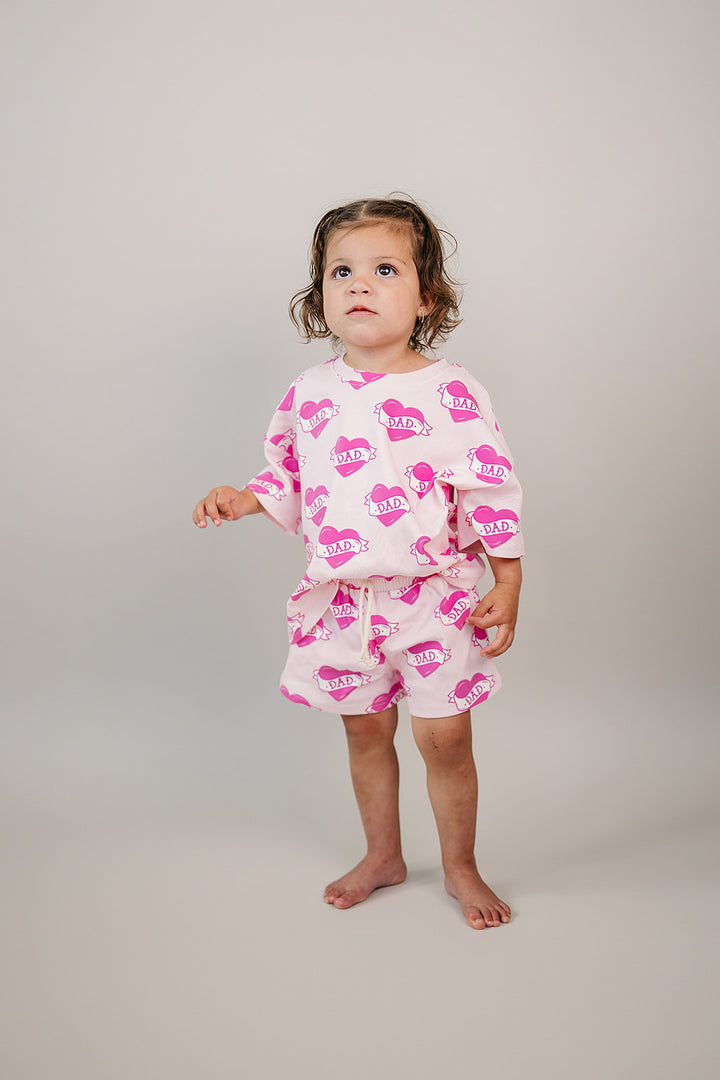 Daddy's Girl Cotton Shorts Set — toddler girl in sweet summer two-piece outfit, Lucky Panda Kids Daddy's Girl Cotton Shorts Set flat lay.Close-up of Daddy's Girl Cotton Shorts Set fabric print and soft cotton detail.Little girl wearing Daddy's Girl Cotton Shorts Set playing outdoors, sunny day.Daddy's Girl Cotton Shorts Set — Father's Day gift idea for girls NB to 9Y, Lucky Panda Kids

