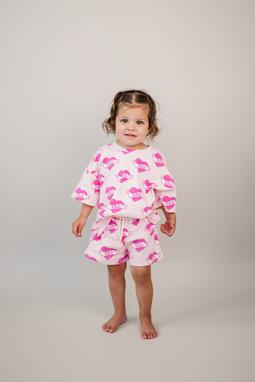 Daddy's Girl Cotton Shorts Set — toddler girl in sweet summer two-piece outfit, Lucky Panda Kids Daddy's Girl Cotton Shorts Set flat lay.Close-up of Daddy's Girl Cotton Shorts Set fabric print and soft cotton detail.Little girl wearing Daddy's Girl Cotton Shorts Set playing outdoors, sunny day.Daddy's Girl Cotton Shorts Set — Father's Day gift idea for girls NB to 9Y, Lucky Panda Kids

