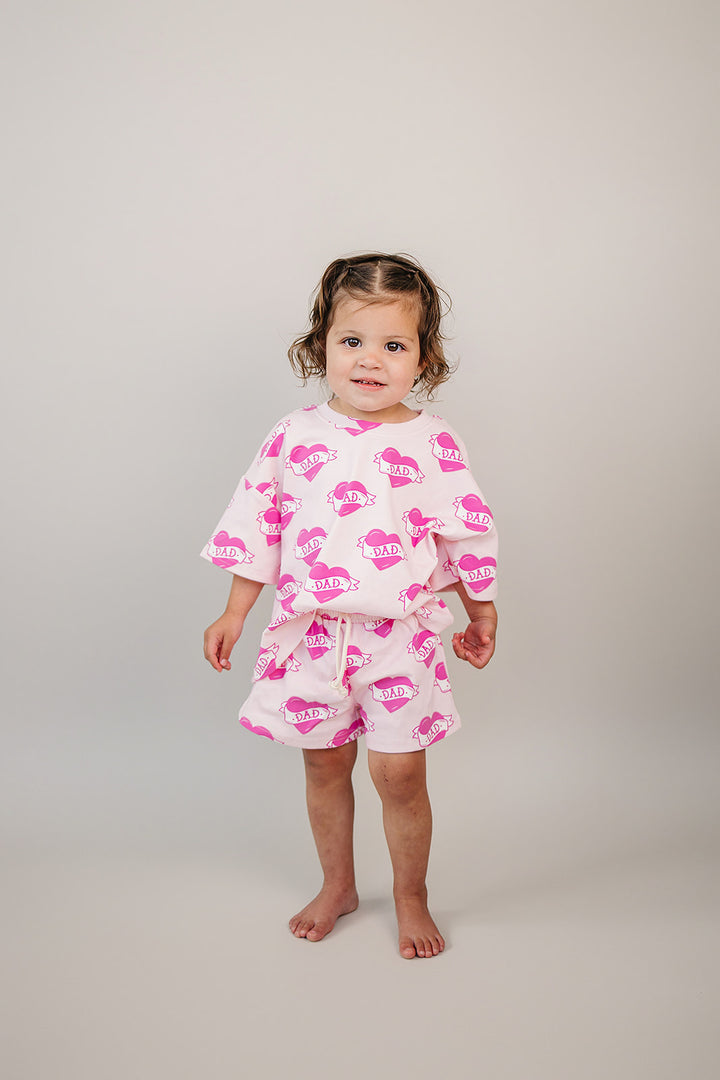 Daddy's Girl Cotton Shorts Set — toddler girl in sweet summer two-piece outfit, Lucky Panda Kids Daddy's Girl Cotton Shorts Set flat lay.Close-up of Daddy's Girl Cotton Shorts Set fabric print and soft cotton detail.Little girl wearing Daddy's Girl Cotton Shorts Set playing outdoors, sunny day.Daddy's Girl Cotton Shorts Set — Father's Day gift idea for girls NB to 9Y, Lucky Panda Kids

