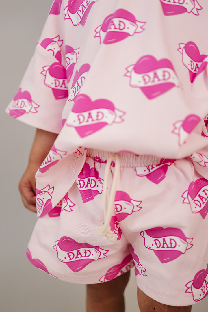 Daddy's Girl Cotton Shorts Set — toddler girl in sweet summer two-piece outfit, Lucky Panda Kids Daddy's Girl Cotton Shorts Set flat lay.Close-up of Daddy's Girl Cotton Shorts Set fabric print and soft cotton detail.Little girl wearing Daddy's Girl Cotton Shorts Set playing outdoors, sunny day.Daddy's Girl Cotton Shorts Set — Father's Day gift idea for girls NB to 9Y, Lucky Panda Kids


