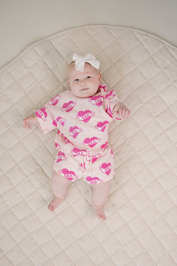 Daddy's Girl Cotton Shorts Set — toddler girl in sweet summer two-piece outfit, Lucky Panda Kids Daddy's Girl Cotton Shorts Set flat lay.Close-up of Daddy's Girl Cotton Shorts Set fabric print and soft cotton detail.Little girl wearing Daddy's Girl Cotton Shorts Set playing outdoors, sunny day.Daddy's Girl Cotton Shorts Set — Father's Day gift idea for girls NB to 9Y, Lucky Panda Kids

