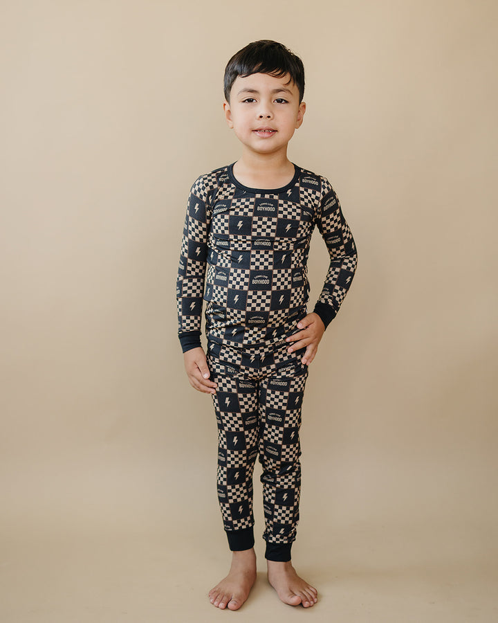 Full-length front view of a child wearing the Long Live Boyhood bamboo two-piece set.