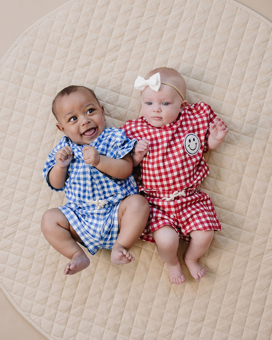 Baby wearing Lucky Panda Kids Blue Gingham Shorts Set — gender neutral cotton two-piece with smiley face patch
Lucky Panda Kids Shorts Set Blue Gingham flat lay — relaxed top with smiley patch and matching elastic waistband shorts
Toddler in Lucky Panda Kids Blue Gingham Shorts Set — sizes 0–3M to 8–9Y, gender neutral summer outfit
Close-up of Lucky Panda Kids Blue Gingham Shorts Set smiley face patch — soft 95% cotton kids two-piece
Lucky Panda Kids Blue Gingham Shorts Set on babies — gender neutral cotton