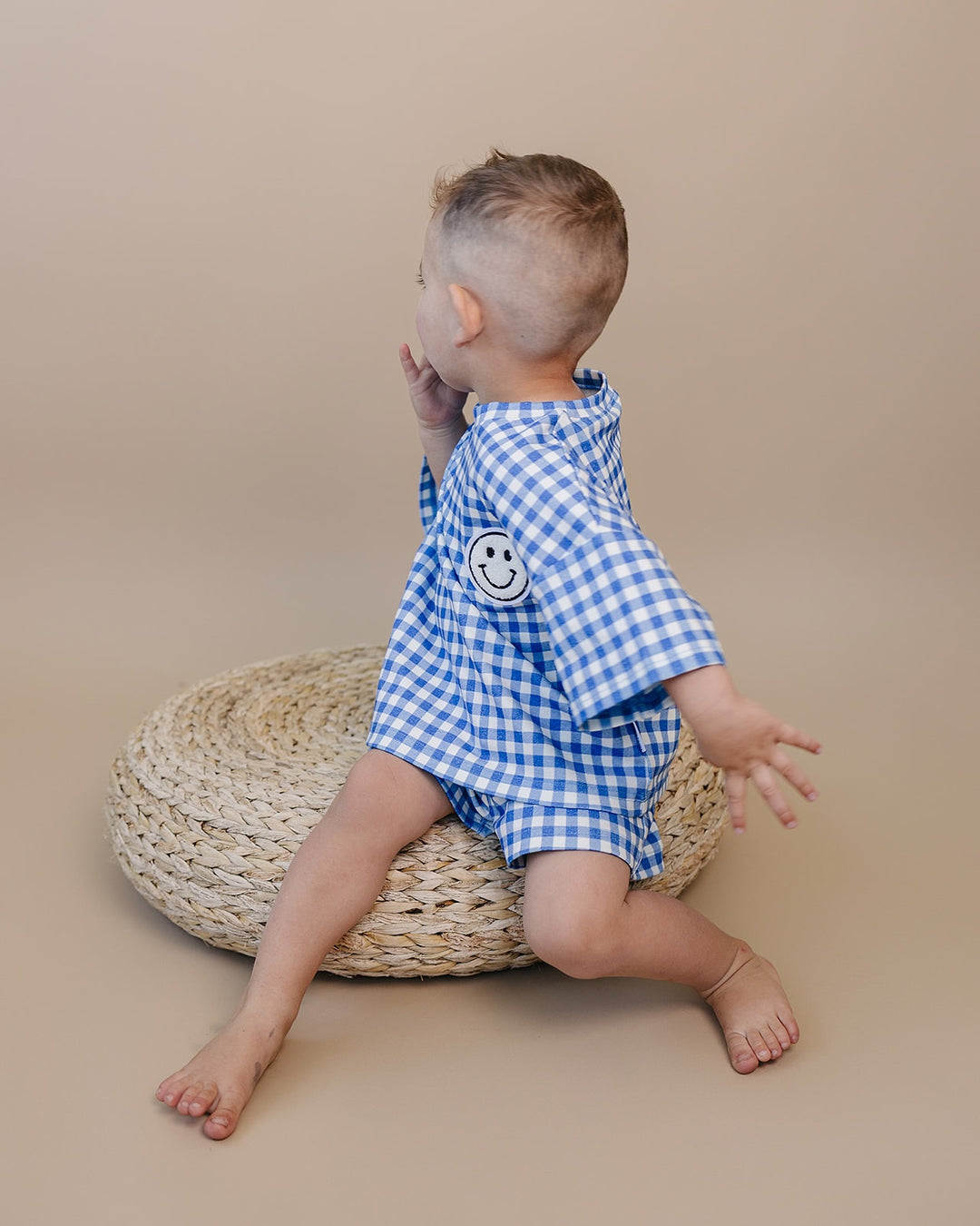Baby wearing Lucky Panda Kids Blue Gingham Shorts Set — gender neutral cotton two-piece with smiley face patch
Lucky Panda Kids Shorts Set Blue Gingham flat lay — relaxed top with smiley patch and matching elastic waistband shorts
Toddler in Lucky Panda Kids Blue Gingham Shorts Set — sizes 0–3M to 8–9Y, gender neutral summer outfit
Close-up of Lucky Panda Kids Blue Gingham Shorts Set smiley face patch — soft 95% cotton kids two-piece
Lucky Panda Kids Blue Gingham Shorts Set on babies — gender neutral cotton