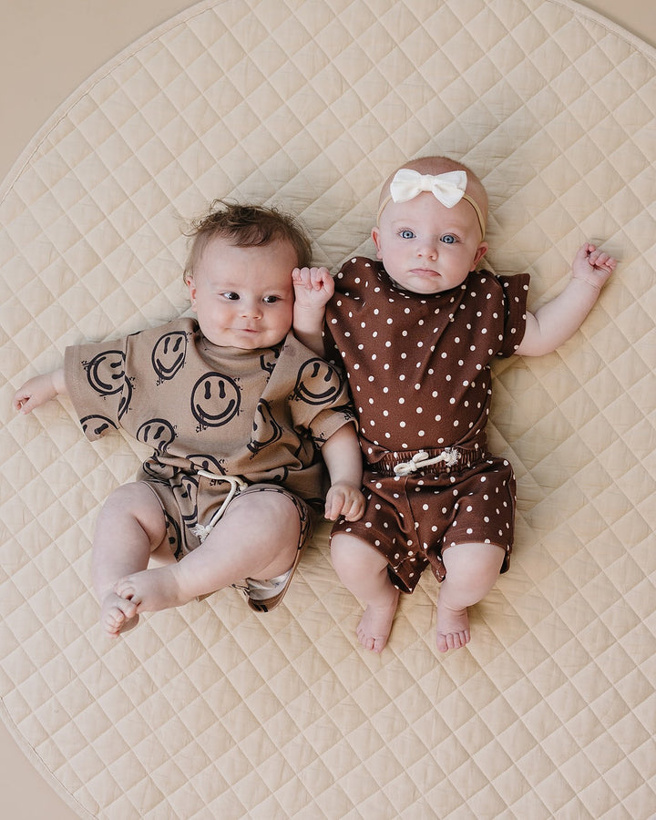 Baby girl wearing Lucky Panda Kids Brown Polka Shorts Set — brown and white polka dot cotton two-piece outfit