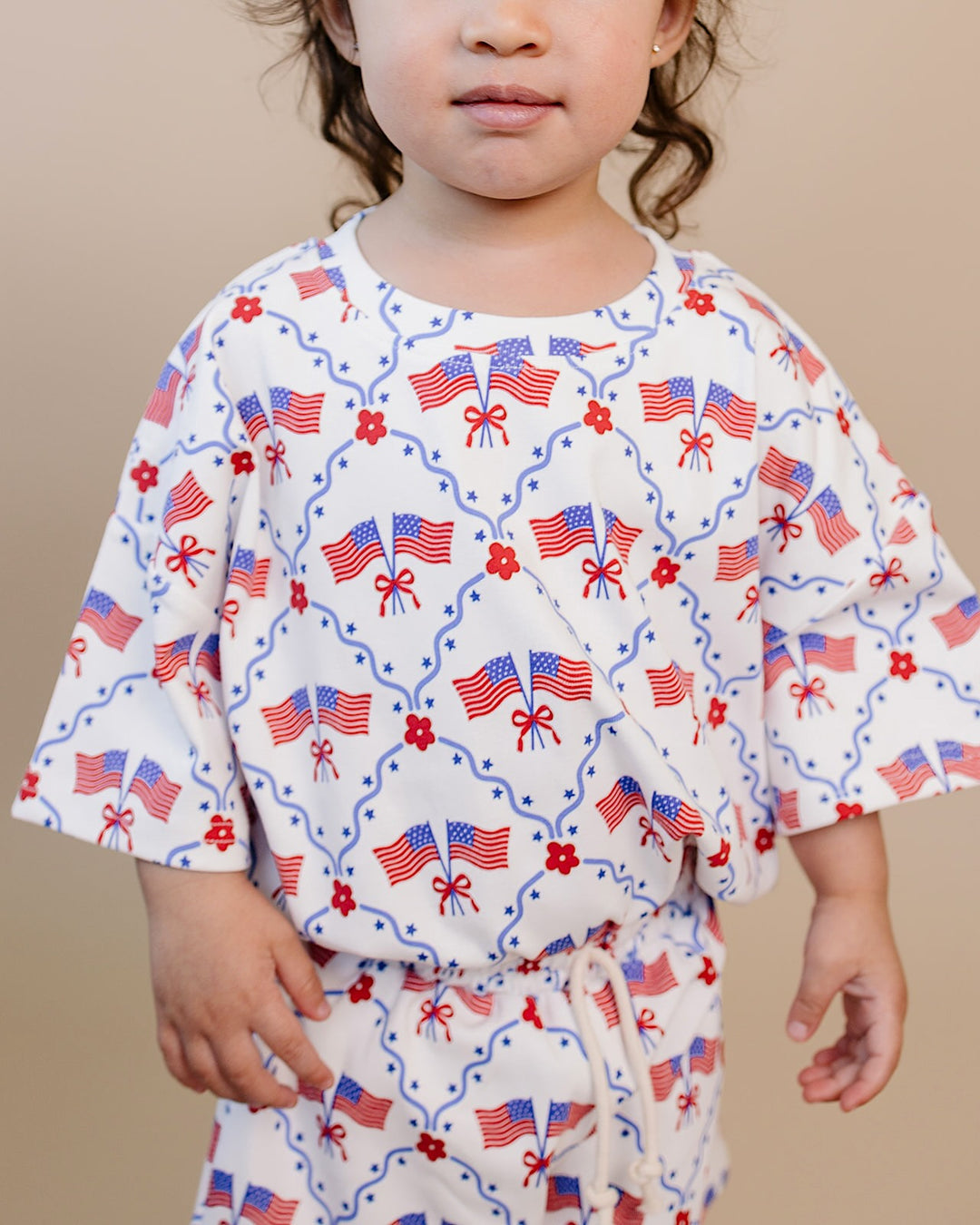 Toddler girl in Lucky Panda Kids 4th of July cotton shorts set, American Girl design — relaxed fit top with faux drawstring
