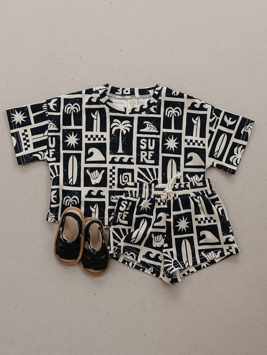Coastal Club Cotton Shorts Set — toddler in coastal-print summer two-piece, Lucky Panda Kids
Lucky Panda Kids Coastal Club Cotton Shorts Set flat lay — Summer1 Collection
Close-up of Coastal Club Cotton Shorts Set showing coastal print and soft cotton weave
Child wearing Coastal Club Cotton Shorts Set at the beach — Lucky Panda Kids summer style
Coastal Club Cotton Shorts Set NB to 9Y — Lucky Panda Kids Summer1 Collection
