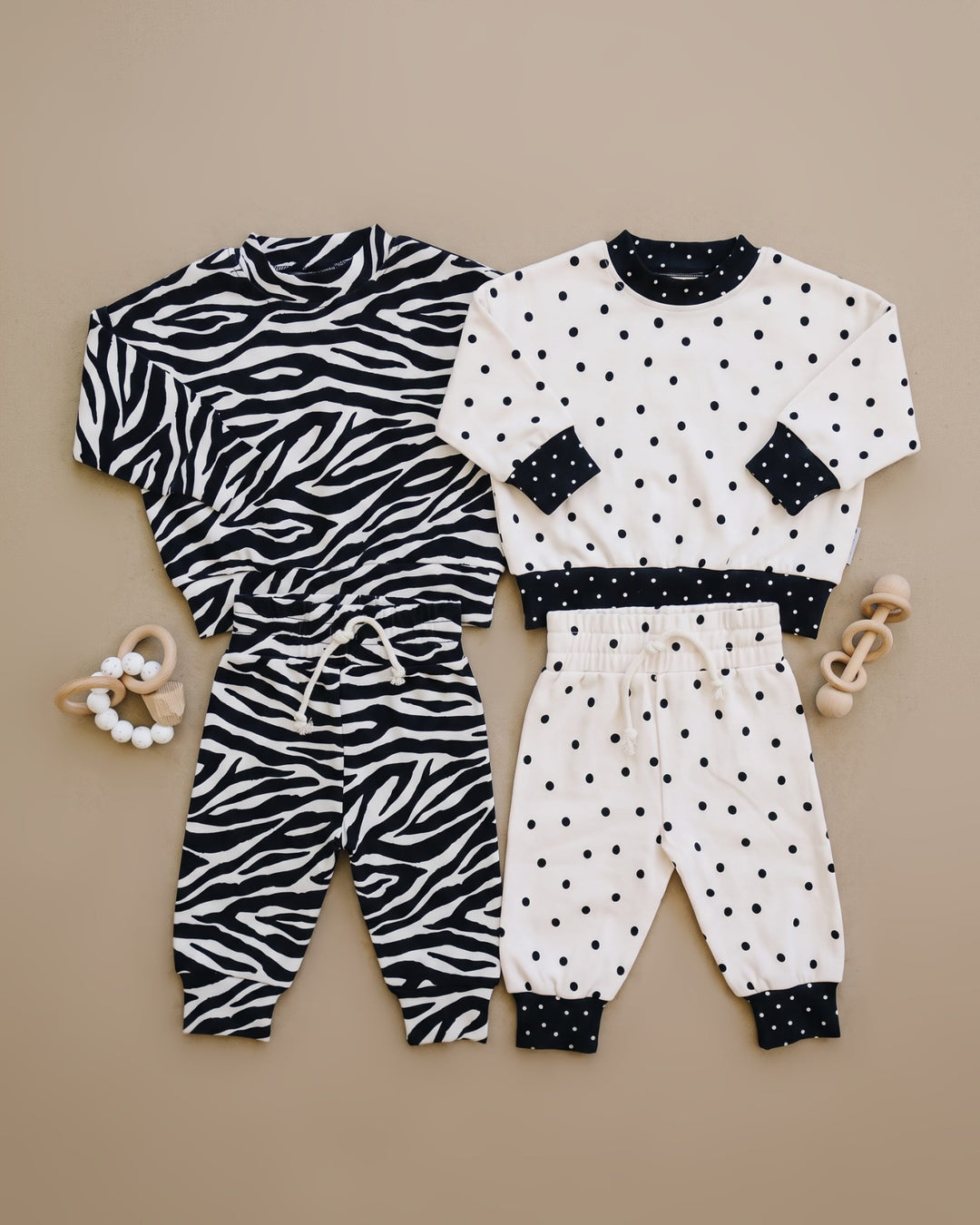 Zebra and Classic Polka Lucky Panda Kids outfits shown in a coordinating flat lay