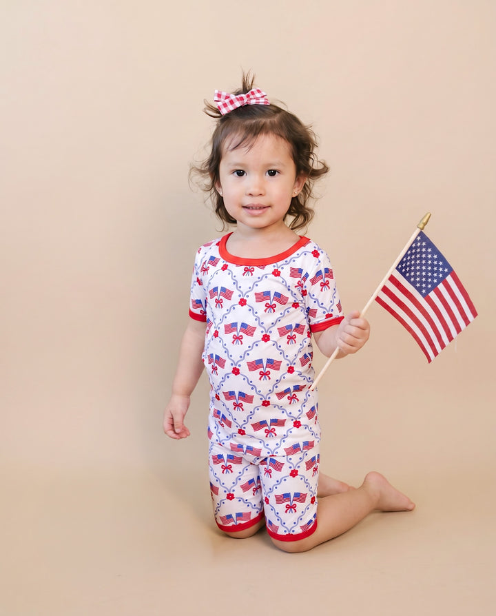 Girl in Lucky Panda Kids 4th of July bamboo shorts set, American Girl design — available 18-24M to 8-9Y