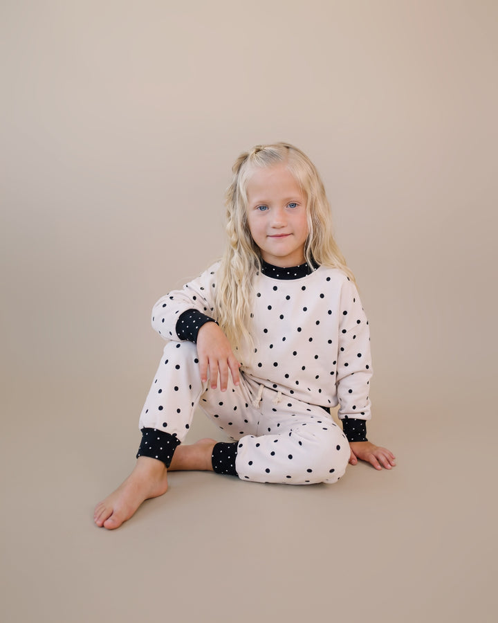 Seated little one wearing the Classic Polka Jogger Set