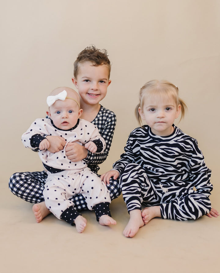 Children wearing coordinating Black Gingham, Classic Polka, and Zebra Lucky Panda Kids styles