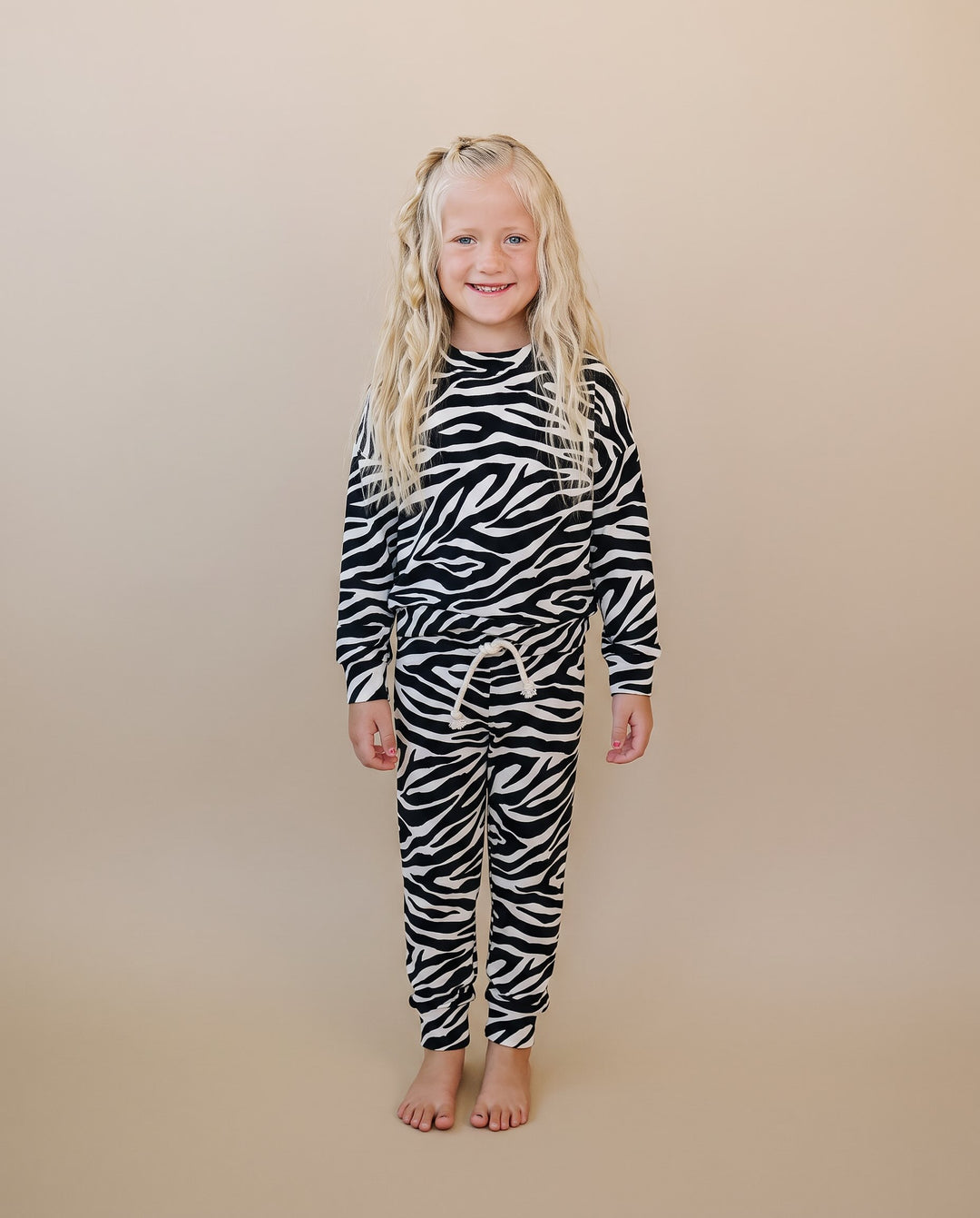 Full length view of little one wearing the Zebra Jogger Set